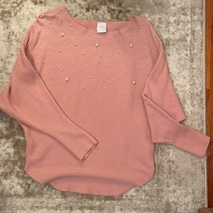 Cute blush top with pearl details on the top. Size medium.